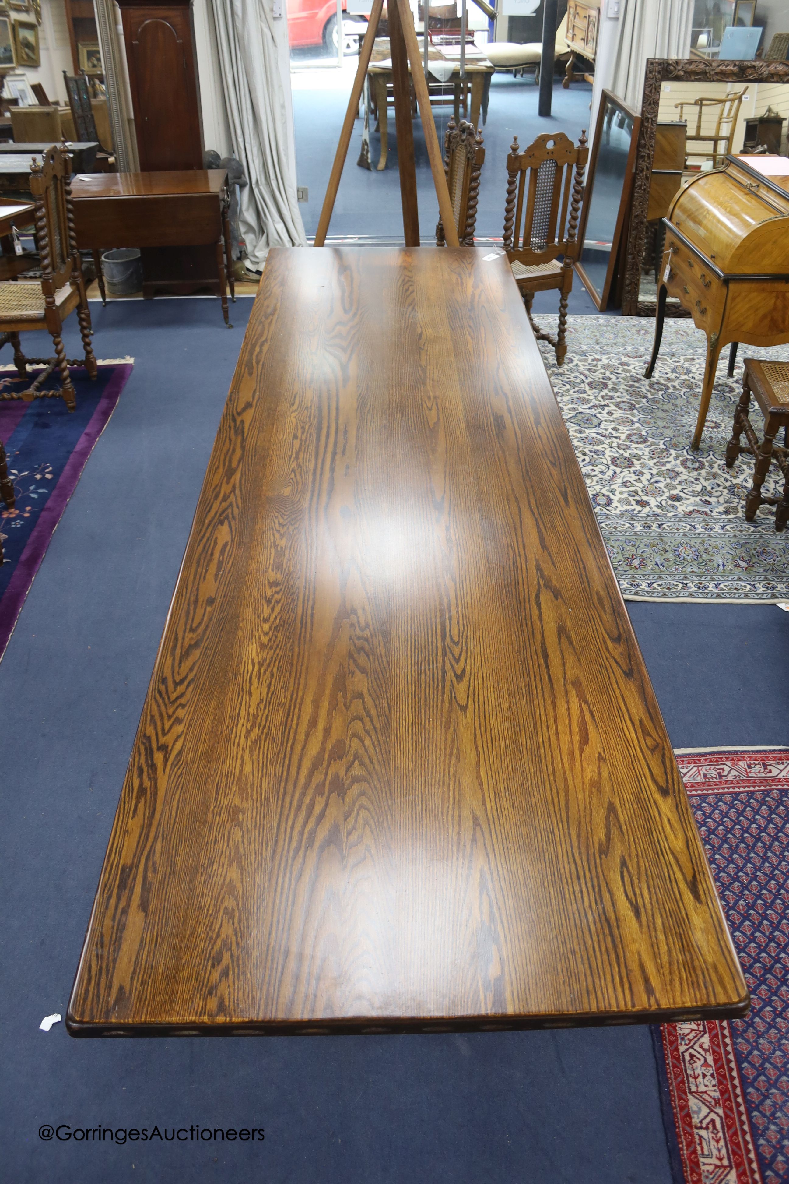 A reproduction 18th century style oak refectory table, width 310cm depth 91cm height 76cm